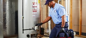 A man working on a newly installed water heater
