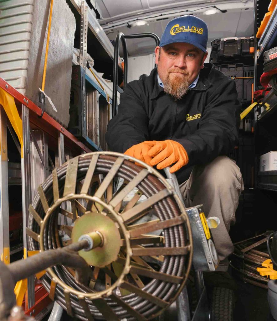Bellows Plumbing, Heating, Cooling and Electrical technician at his service van