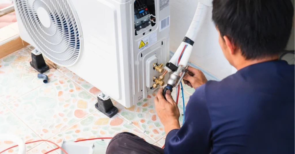 HVAC technician comparing heat pump and gas furnace options to help homeowner choose best heating system