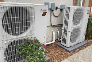 Bellows Plumbing technician installing a Mitsubishi heat pump at a San Jose home