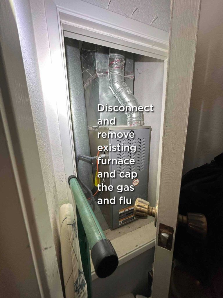 Old Payne gas furnace being disconnected and removed from a closet in Carmel Valley before heat pump installation