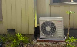 Bellows Plumbing Heating Cooling & Electric technician installing new Lennox air conditioning system at San Jose home