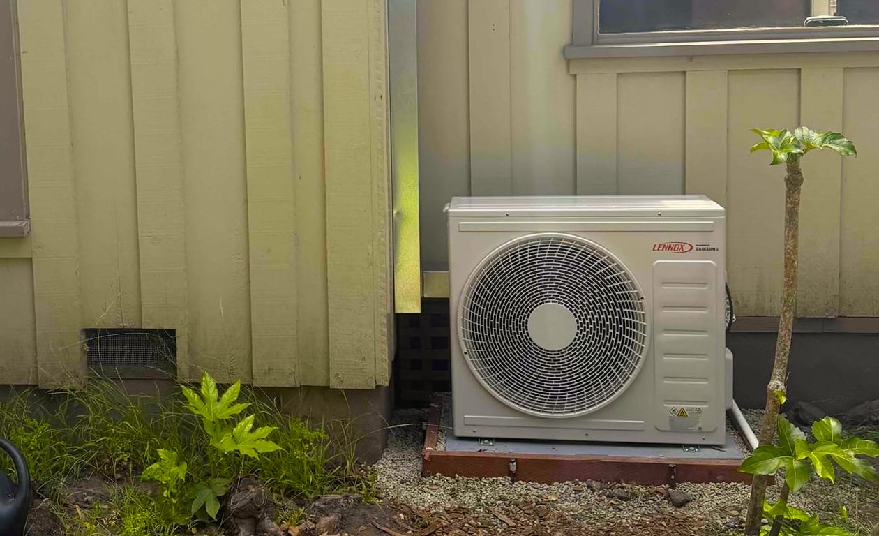 Bellows Plumbing Heating Cooling & Electric technician installing new Lennox air conditioning system at San Jose home
