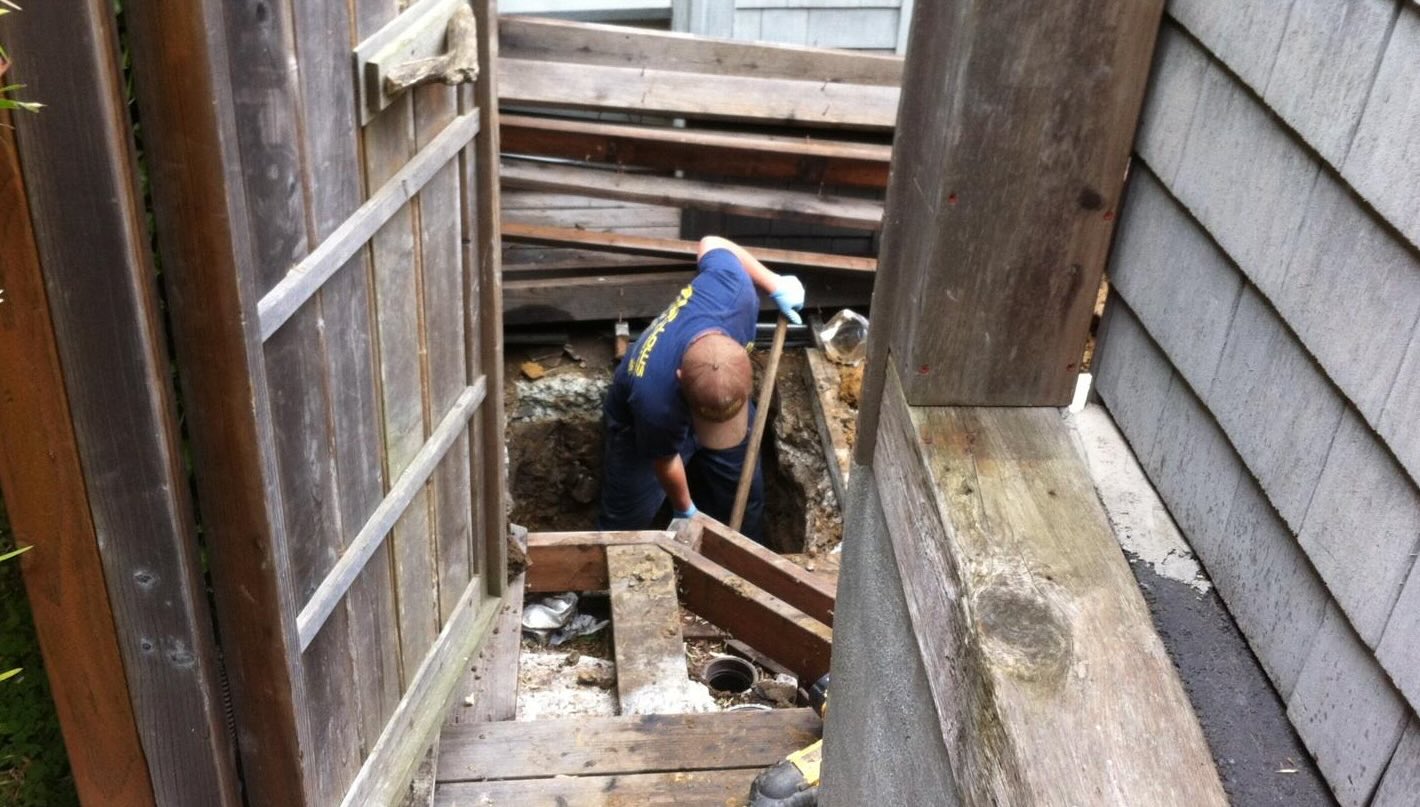 Bellows Plumbing plumber clearing a clogged drain in a Santa Cruz home