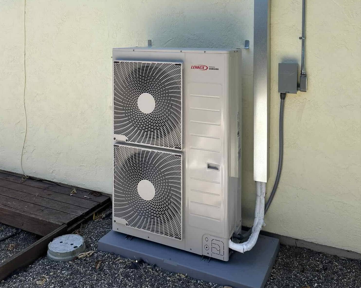 Lennox ML15 5-ton heat pump outdoor unit installed by Bellows on a concrete pad at a Carmel Valley home