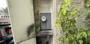 Outdated outdoor electrical panel with emergency disconnect at Santa Cruz HOA property — Bellows Electric