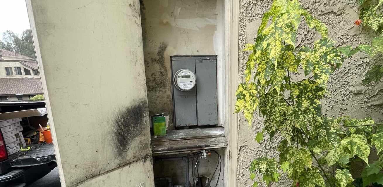 Outdated outdoor electrical panel with emergency disconnect at Santa Cruz HOA property — Bellows Electric